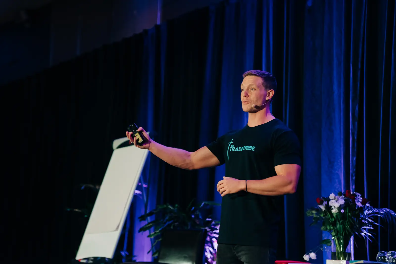 Ben Knight presenting live on stage at a Trade Tribe event