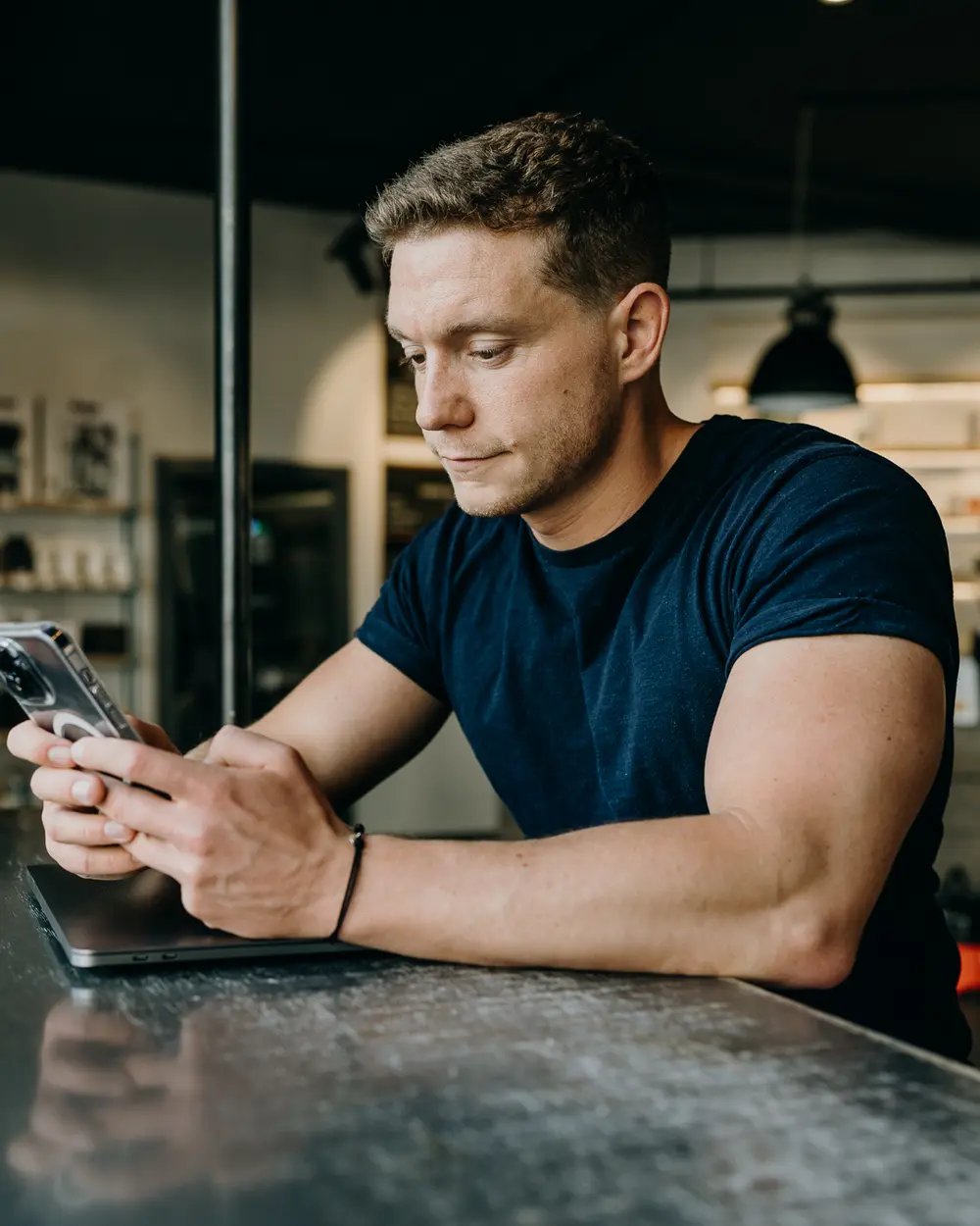 Ben Knight checking his investments on his phone in a few minutes